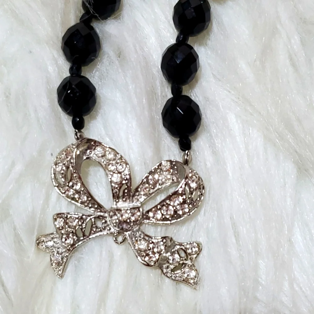 Boutique black, silver tone with a bling bow necklace